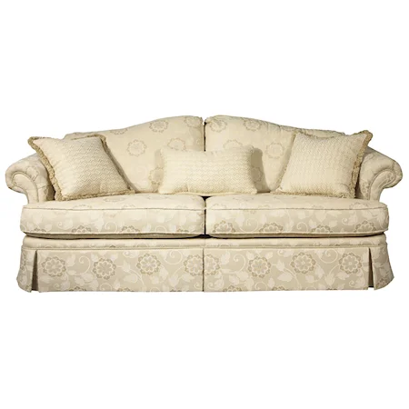 Camel Back Sofa with Accent Pillows and Traditional Furniture Skirt